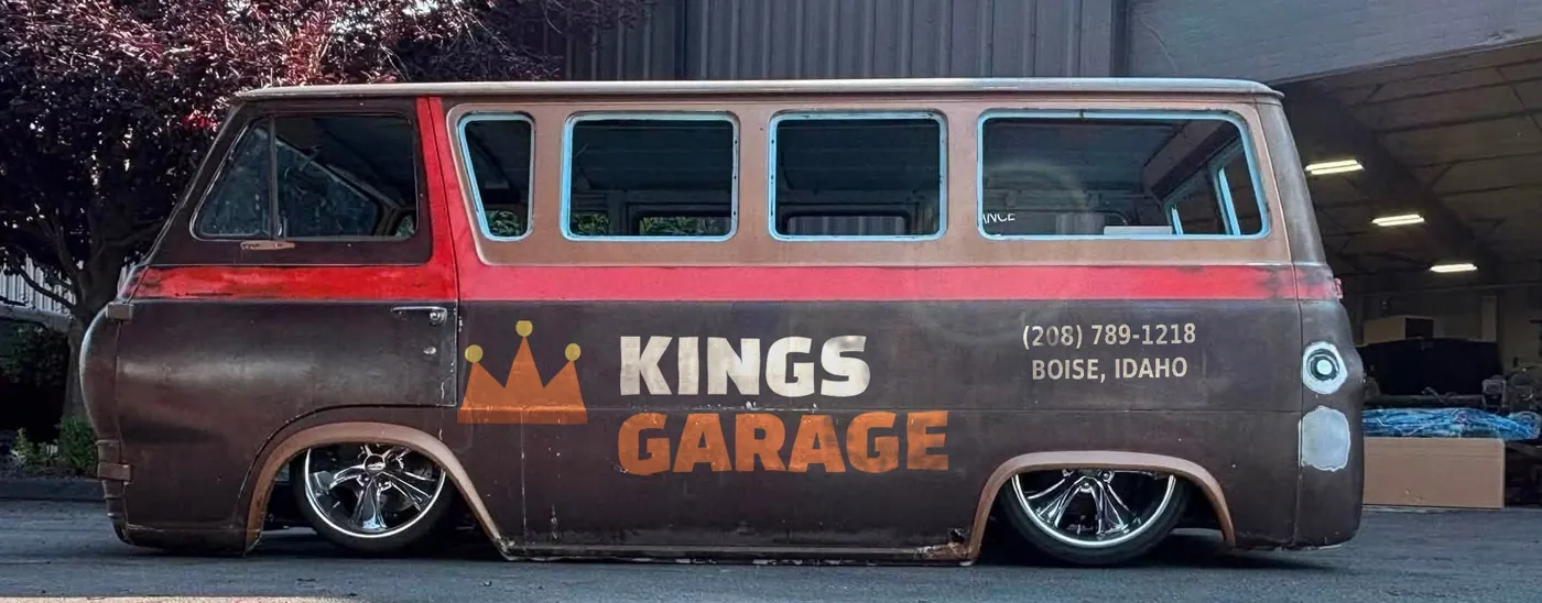 The Kings Garage shop van - a lowered 1960s Ford Econoline with the crown logo hand-painted on the side